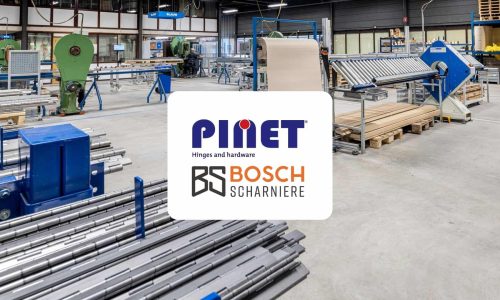 Robuuste werkplaats of magazijn met Bosch scharnieren en hardware, geschikt voor industriële toepassingen en meubelproductie, met verschillende machines en materialen voor het maken van stevige, duurzame scharnieren.